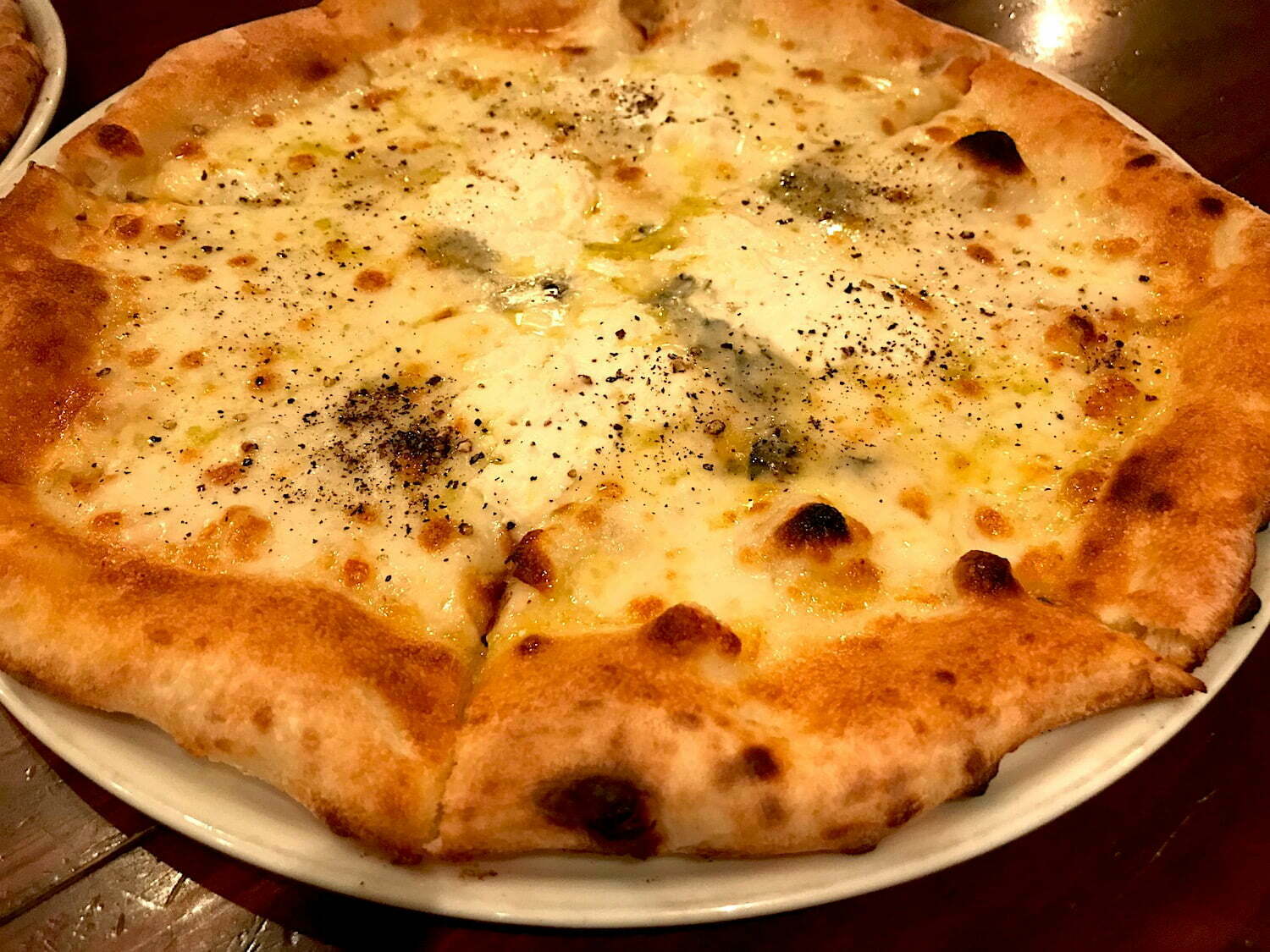 Quattro cheese Napoli pizza with honey